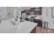 Modern kitchen with stainless steel appliances, a center island, and granite countertops at 19455 Smith Cir, Cornelius, NC 28031