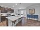 Modern kitchen with center island, hardwood floors, stainless steel appliances at 19455 Smith Cir, Cornelius, NC 28031