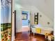Bathroom with wooden floors, shower, yellow and white towels and sunflowers at 200 W 14Th St, Salisbury, NC 28144