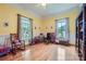 Bright bedroom with yellow walls, white trim, and natural light from two windows at 200 W 14Th St, Salisbury, NC 28144