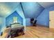 Bedroom with blue textured walls, wood floors, and desk area at 200 W 14Th St, Salisbury, NC 28144