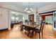 Open dining room boasts stylish chandelier and gorgeous wood floors at 200 W 14Th St, Salisbury, NC 28144
