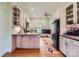Well-lit kitchen featuring custom cabinets, hardwood floors and stainless-steel appliances at 200 W 14Th St, Salisbury, NC 28144