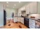 Modern kitchen with custom cabinets, hardwood floors, and stainless-steel appliances at 200 W 14Th St, Salisbury, NC 28144