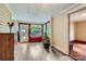Bright sun room features classic wood floors, red trim, a large window, and natural light at 200 W 14Th St, Salisbury, NC 28144