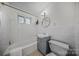 Clean bathroom with subway tile, modern fixtures, and a well-lit vanity at 201 N Dotger Ave # C8, Charlotte, NC 28207