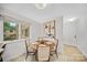 Cozy dining area with wood floors and large window with views of the outdoors at 201 N Dotger Ave # C8, Charlotte, NC 28207