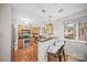Modern kitchen with stainless steel appliances, bar seating, and ample natural light at 201 N Dotger Ave # C8, Charlotte, NC 28207