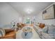Spacious living room with hardwood floors, comfortable seating, and natural light at 201 N Dotger Ave # C8, Charlotte, NC 28207