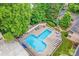An aerial view of the clean community pool surrounded by trees and a courtyard at 201 N Dotger Ave # C8, Charlotte, NC 28207