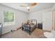 Comfortable bedroom featuring a bed, toys, and a large window for natural light at 2034 Houle Ln, Charlotte, NC 28214