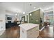 Open-concept living space connecting the kitchen, dining, and living areas with hardwood floors and modern decor at 2034 Houle Ln, Charlotte, NC 28214