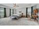 Bright main bedroom with natural light, ceiling fan, and carpet at 2034 Houle Ln, Charlotte, NC 28214