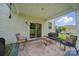 Covered patio space with outdoor seating and sliding glass doors at 2034 Houle Ln, Charlotte, NC 28214
