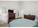 This bedroom features neutral walls, with a full-sized bed and matching dressers at 209 Mcfadden St, Rock Hill, SC 29730