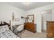 This bedroom features a writing desk with a faux fur chair and a full-size bed at 209 Mcfadden St, Rock Hill, SC 29730