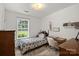 This bedroom features a writing desk with a faux fur chair and a full-size bed at 209 Mcfadden St, Rock Hill, SC 29730