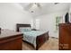 Comfortable bedroom with carpet, modern decor, ceiling fan, and natural light from the windows at 209 Mcfadden St, Rock Hill, SC 29730