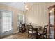 Cozy dining area featuring hardwood floors, modern lighting fixture, and access to outdoor patio at 209 Mcfadden St, Rock Hill, SC 29730
