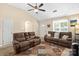 Spacious living room with high ceilings, ceiling fan, neutral colors, and carpeted flooring at 209 Mcfadden St, Rock Hill, SC 29730