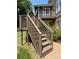 Exterior view of the wooden deck, showcasing access stairs and connection to the screened porch above at 228 31St Avenue Ne Ct, Hickory, NC 28601