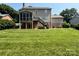 The backyard features a screened-in porch and wooden stairs at 228 31St Avenue Ne Ct, Hickory, NC 28601