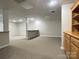 Large finished basement with neutral walls, carpet and a built-in bar at 228 31St Avenue Ne Ct, Hickory, NC 28601