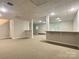 Large finished basement with neutral walls, carpet and a built-in bar at 228 31St Avenue Ne Ct, Hickory, NC 28601