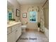 Bright bathroom featuring a vanity, toilet and shower-tub combo at 228 31St Avenue Ne Ct, Hickory, NC 28601