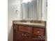 Charming bathroom vanity with granite countertop and decorative mirror frame at 228 31St Avenue Ne Ct, Hickory, NC 28601