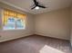This bedroom has neutral walls, carpet and a fan at 228 31St Avenue Ne Ct, Hickory, NC 28601