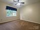 This bedroom has neutral walls, carpet and a fan at 228 31St Avenue Ne Ct, Hickory, NC 28601
