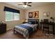 This staged bedroom features a bed with a patterned comforter at 228 31St Avenue Ne Ct, Hickory, NC 28601