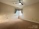 This bedroom has neutral walls, carpet and a fan at 228 31St Avenue Ne Ct, Hickory, NC 28601
