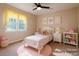 Bright, staged bedroom featuring a cute bed, soft rug and natural light at 228 31St Avenue Ne Ct, Hickory, NC 28601