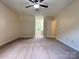 Open bonus room features neutral carpeting and large windows at 228 31St Avenue Ne Ct, Hickory, NC 28601