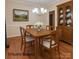 Dining room features hardwood floors, a dining table with chairs, and a chandelier at 228 31St Avenue Ne Ct, Hickory, NC 28601