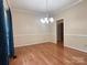 Spacious dining room features hardwood floors and a modern chandelier at 228 31St Avenue Ne Ct, Hickory, NC 28601