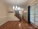 Dining room with hardwood floors, a modern chandelier, and large window at 228 31St Avenue Ne Ct, Hickory, NC 28601