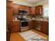 Kitchen featuring wood cabinets, stainless steel appliances, and hardwood floors at 228 31St Avenue Ne Ct, Hickory, NC 28601