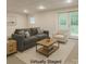 This is a virtually staged living room with a cozy seating area and natural light at 228 31St Avenue Ne Ct, Hickory, NC 28601