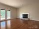 Living room featuring hardwood floors, fireplace, and glass doors at 228 31St Avenue Ne Ct, Hickory, NC 28601
