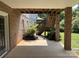 Covered brick patio with view of brick stairs and lawn beyond at 228 31St Avenue Ne Ct, Hickory, NC 28601