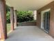 Covered brick patio offers a shady spot to enjoy the outdoors with access to the backyard at 228 31St Avenue Ne Ct, Hickory, NC 28601