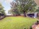 Spacious backyard featuring a large grassy area and a storage shed at 2421 Morton St, Charlotte, NC 28208