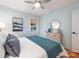 Bright bedroom features neutral decor, hardwood floors, and a window at 2421 Morton St, Charlotte, NC 28208