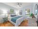 Bright bedroom features two windows, hardwood floors, and neutral decor at 2421 Morton St, Charlotte, NC 28208