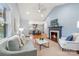The spacious living room showcases a fireplace, hardwood floors, and seamlessly connects to the kitchen at 2421 Morton St, Charlotte, NC 28208