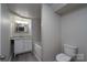 Bright bathroom featuring a vanity with granite countertop and stylish fixtures at 2617 Shady Lane Ave, Concord, NC 28027