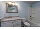 Bathroom with vanity, granite countertop, toilet, and a shower with a white shower tub at 2617 Shady Lane Ave, Concord, NC 28027